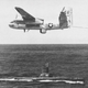 A Grumman S2F-3 Tracker of anti-submarine squadron VS-36 Grey Wolves, with its MAD boom extended, passes over the Tench-class submarine USS Sirago (SS 485) in 1962 (US Navy)
